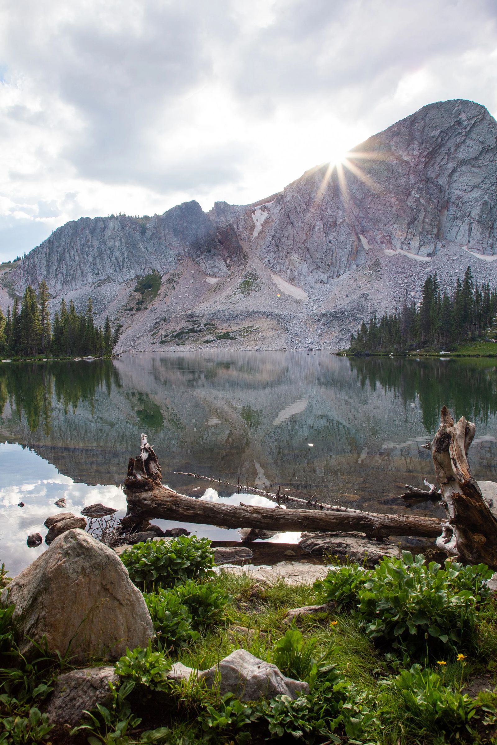 A calm mountain lake at sunrise